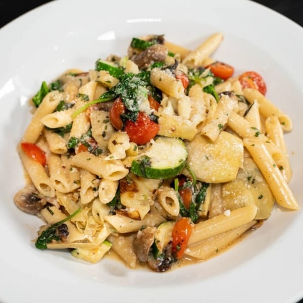 Giuseppe's penne pasta with zucchini, tomatoes, mushrooms, spinach, and parmesan cheese.